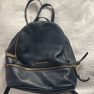 Navy backpack with three pockets